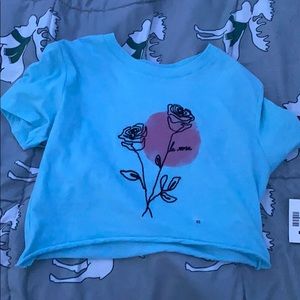 Blue top with flour design